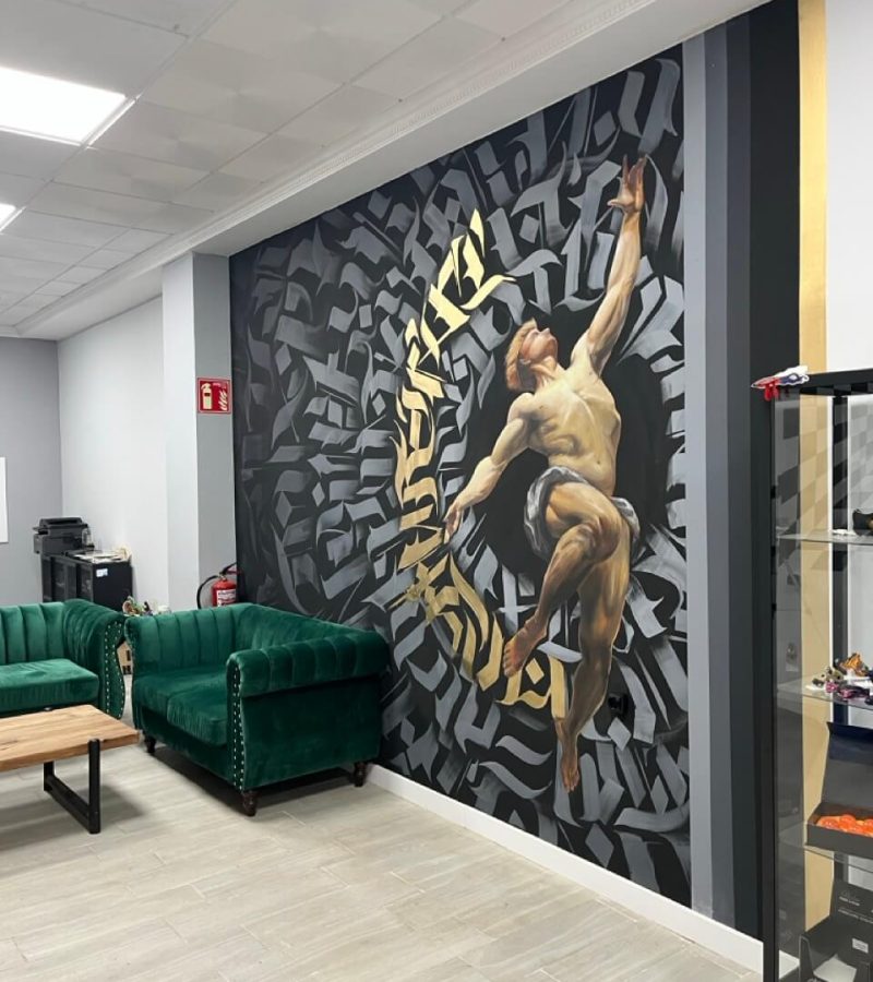 Mural de graffiti en estudio de tatuajes de Valencia